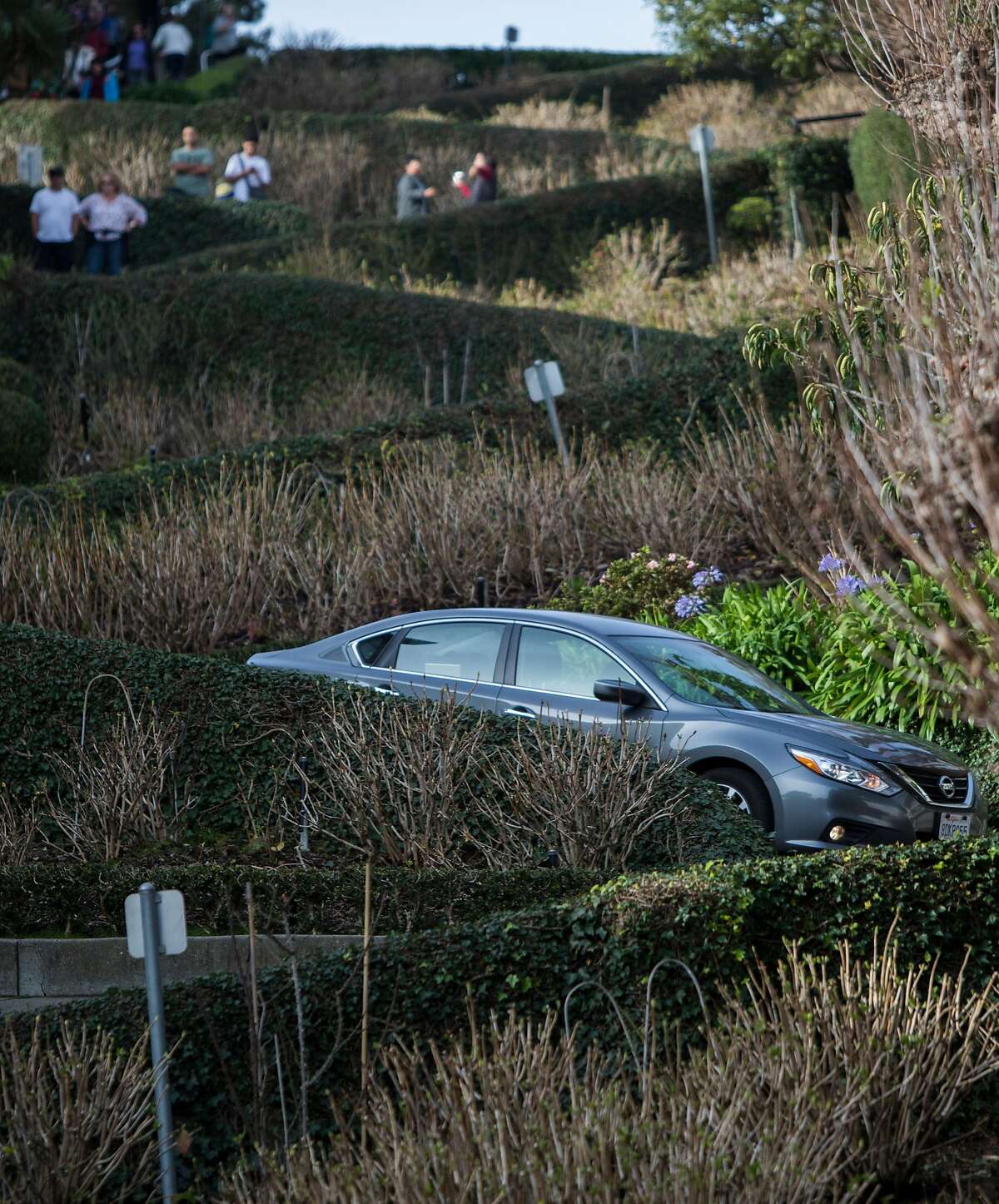 Cars drive down the famously crooked portion of Lombard Street in San Francisco, Calif. Saturday, Jan. 26, 2019.
