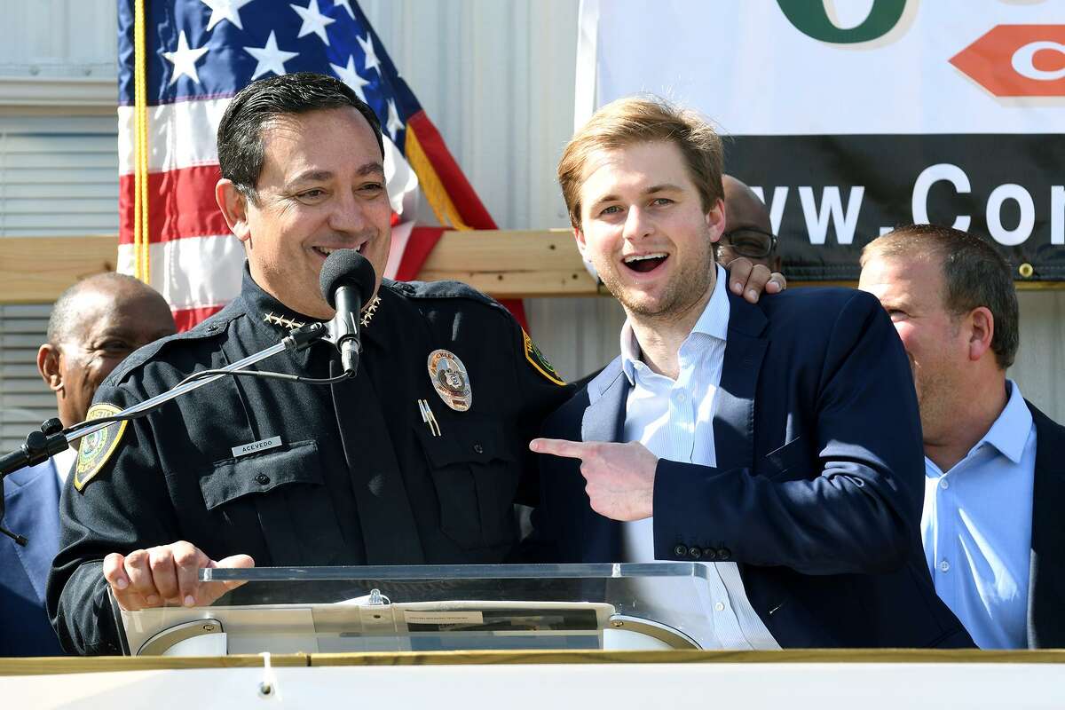 Houston Chief of Police Art Acevedo, from left, shares a laugh at the podium with Patrick Fertitta, a son of Tilman Fertitta, Chairman of the Board for the Houston Police Foundation, during the groundbreaking ceremony for the Tilman Fertitta Family Tactical Training Center in Houston on Jan. 28, 2019.