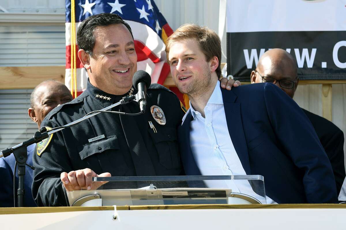 Houston Chief of Police Art Acevedo, from left, shares the podium with Patrick Fertitta, a son of Tilman Fertitta, Chairman of the Board for the Houston Police Foundation, during the groundbreaking ceremony for the Tilman Fertitta Family Tactical Training Center in Houston on Jan. 28, 2019.