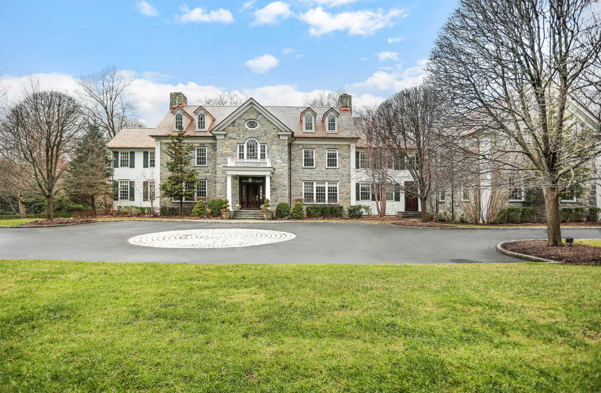 The Georgian stone manor at 69 Porchuck Road is part of 4.18-acre estate of...