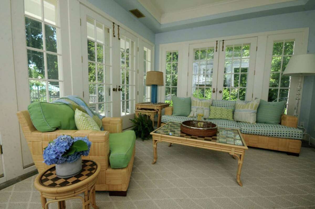 This home’s sunroom had such great character, but the furnishings had been faded by the sun and needed to be reupholstered. The walls were muted with a lighter shade blue. A new area rug was added for comfort and to complete the soft, welcoming aesthetic.