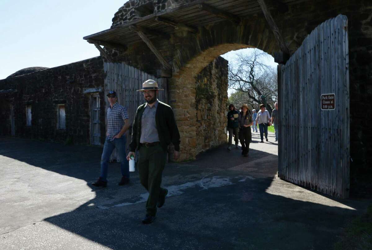 At San Antonio Missions National Historical Park, federal employee Jorge Hernandez walks through the main gate as he starts a tour of Mission San José on Jan. 28, 2019. The National Park Service resumed regular operations nationwide now that the federal government reopened, at least for now.