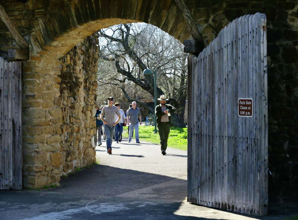 Jorge Hernandez, a federal employee, checks the time as he starts a tour of Mission San José, on Monday, Jan. 28, 2019. The San Antonio Missions National Park returned to full staffing after the federal government shutdown ended, at least temporarily.