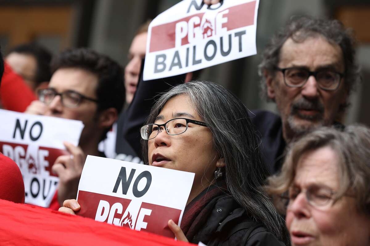 Melanie Liu with the California Progressive Alliance protests a PG&E bail out with others before a previously unscheduled California Public Utilities Commission meeting��on Monday, January 28, 2019.
