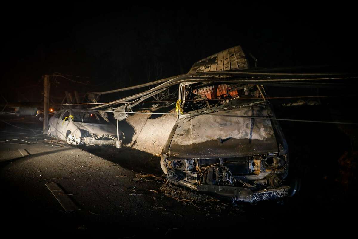 A vehicle is incinerated on Pearson Road after the Camp Fire ravaged the town of Paradise, California, on Friday, Nov. 9, 2018.