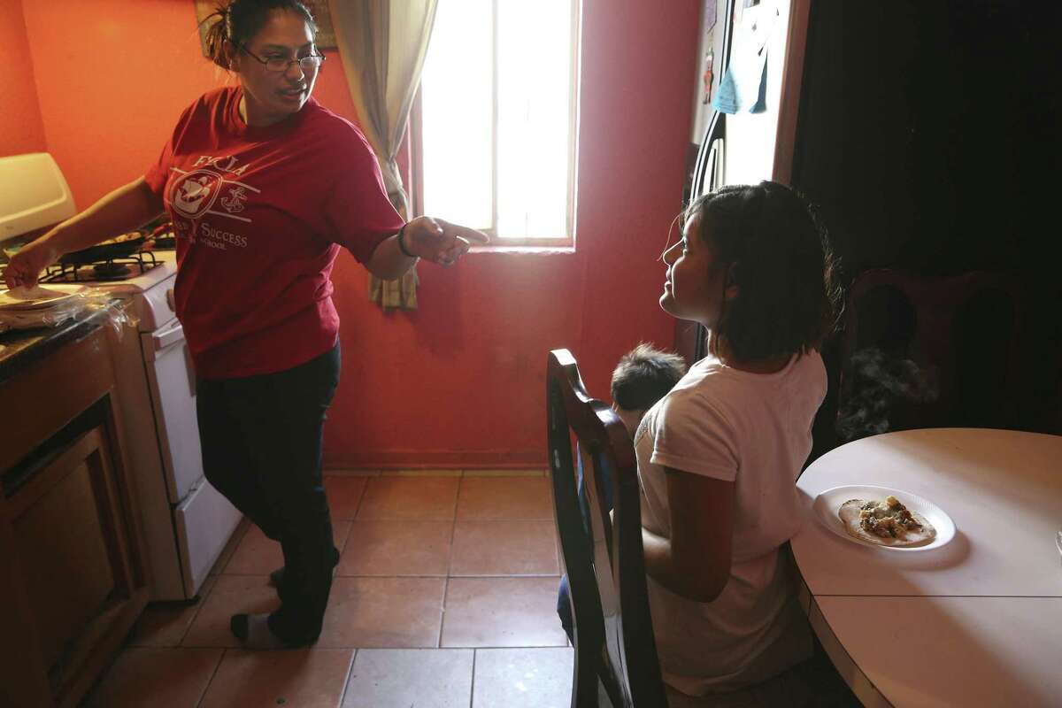 Crystal Guevara-Alvarado, 30, makes breakfast for her four children and two nieces, including her daughter, Ellena Guevara, recently. Guevara-Alvarado was an immigration detention officer at a private center in Pearsall, Texas, for seven years and was able to help support her family by working long hours at the job. Her divorce in 2015 led to instability and pressure on her family. She quit her job in November due to the long hours and commutes taking a toll on her four children. She moved in with her sister, who offered to help.