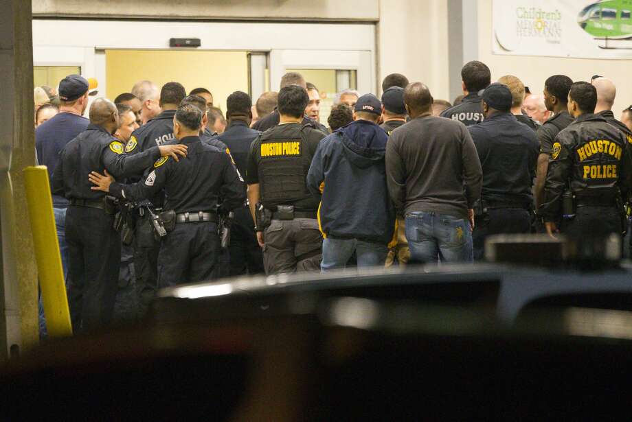   Officers listen to Houston Police Chief Art Acevedo exit the Emergency Department at Memorial Hermann Hospital after visiting injured officers at the Texas Medical Center on Monday, January 28, 2019. Four officers were shot dead on Monday afternoon, two of whom were described as critical but stable, while the drug officers were trying to execute a search warrant. Photo: Mark Mulligan / Personal Photographer 