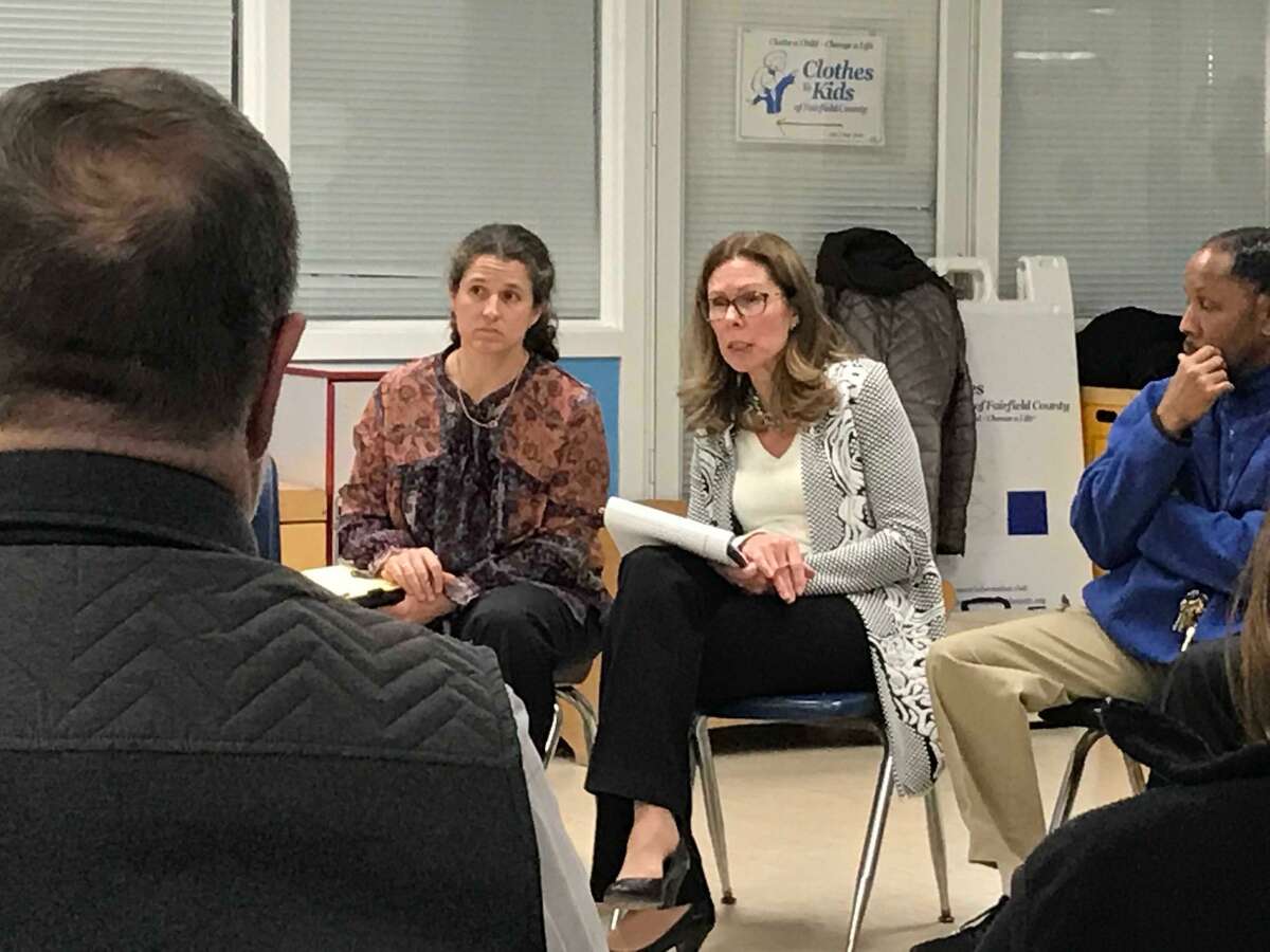 Rebecca Neuburger (left) and Charlotte Lansinger from the Police Executive Research Forum listening to residents at the Yerwood Center about what sort of new police chief Stamford should hire.