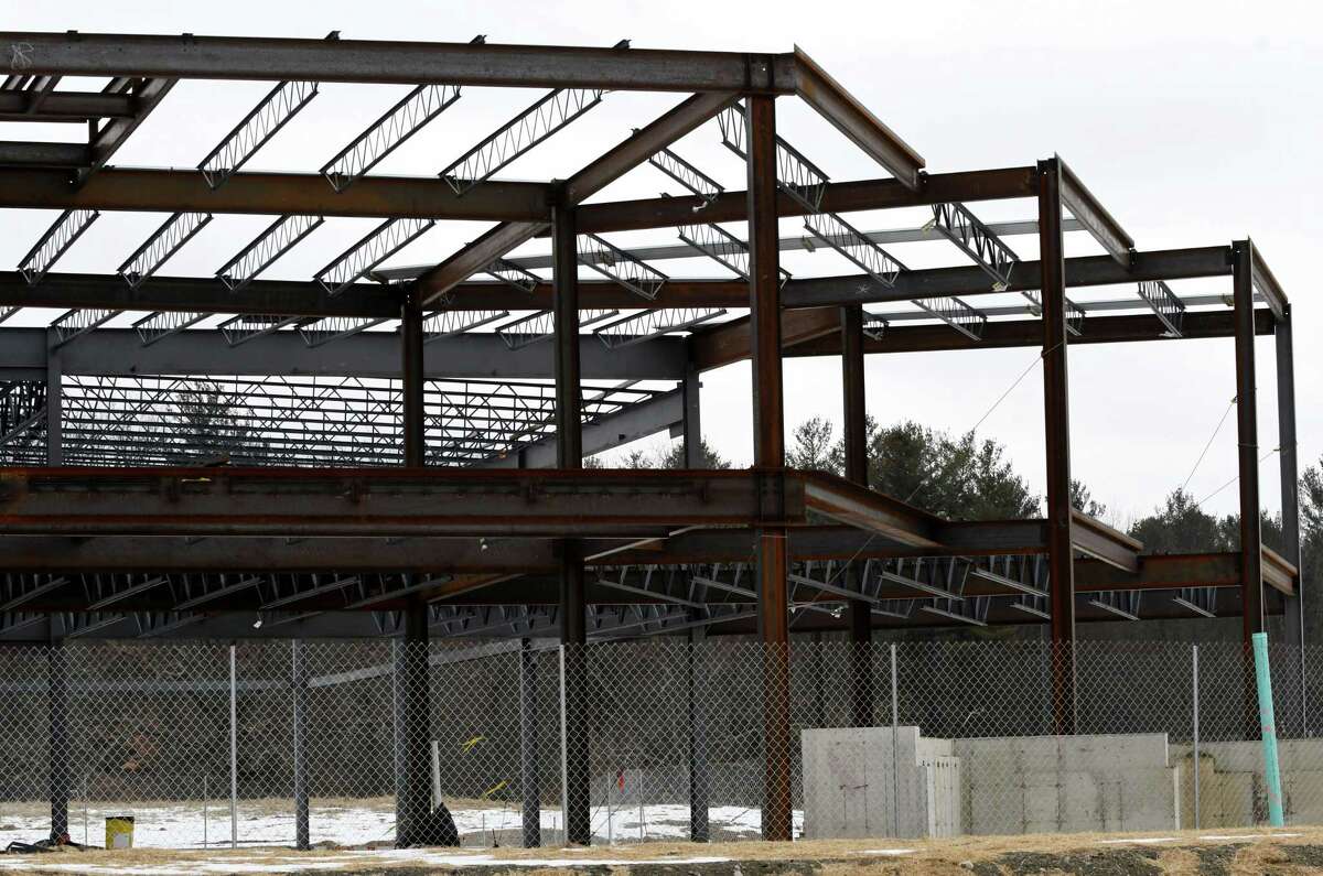 BBL has a erected a fence around the Monolith Solar construction site on Tuesday, Jan. 29, 2019, at the Vista Technology Campus in Slingerlands, N.Y. Monolith abruptly stopped construction of the $4.9 million headquarters building back in September around the same time it furloughed more than 50 workers. Pioneer Bank has sent town a notice of default on the now abandoned construction project. (Will Waldron/Times Union)