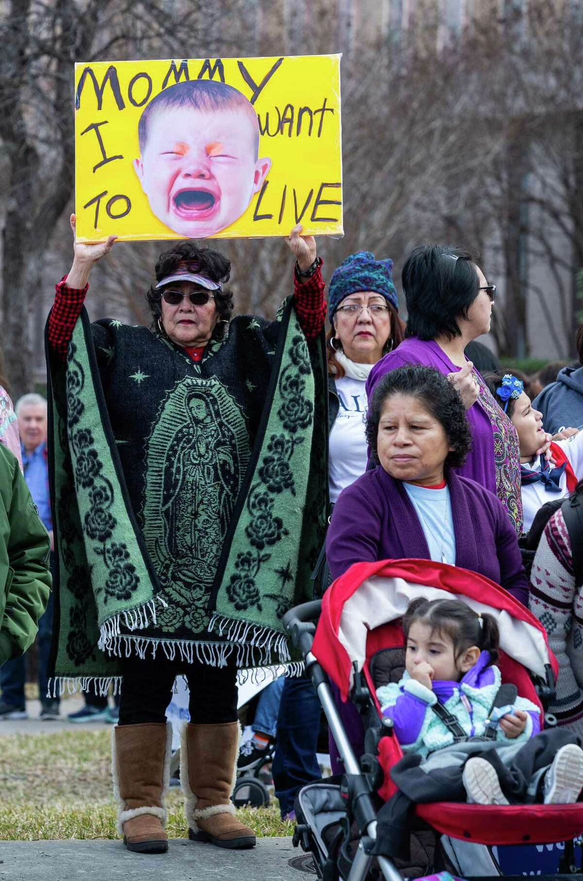 Lupe Rojas, from San Antonio, held up a sign before the start of the march during the Texas Rally for Life at the Texas State Capitol on January 26, 2019 in Austin, Texas.