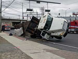 There were no injuries when a truck tipped over on Fairfield Avenue near Pine Street in Bridgeport, Conn., on Jan. 29, 2019. Photo: Contributed Photo / Contributed Photo / Connecticut Post Contributed