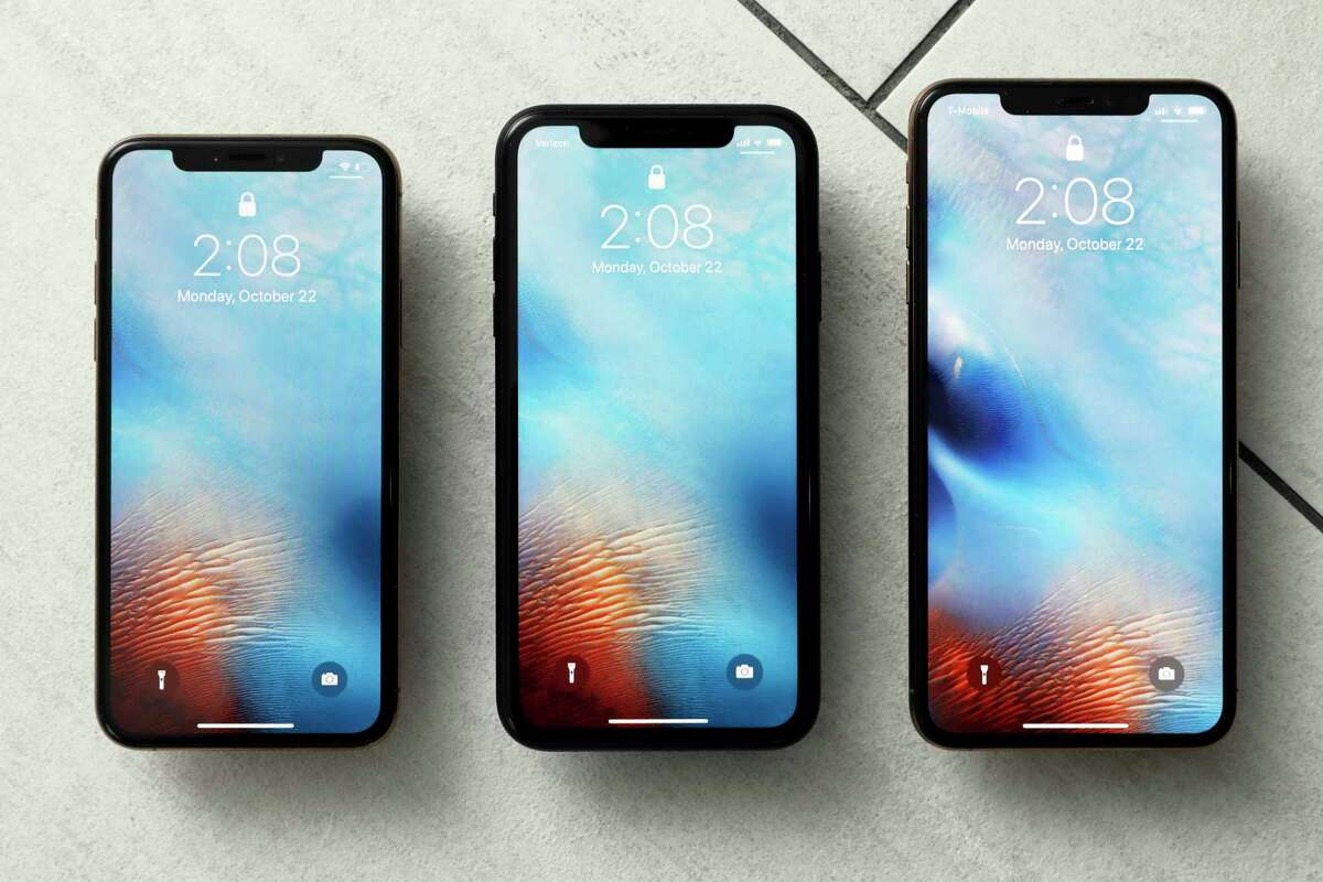 FILE - This Oct. 22, 2018, file photo shows the iPhone XS, from left, iPhone XR, and the iPhone XS Max in New York. Apple hoped to offset slowing demand for iPhones by raising the prices of its most important product, but that strategy seems to have backfired after sales sagged during the holiday shopping season.