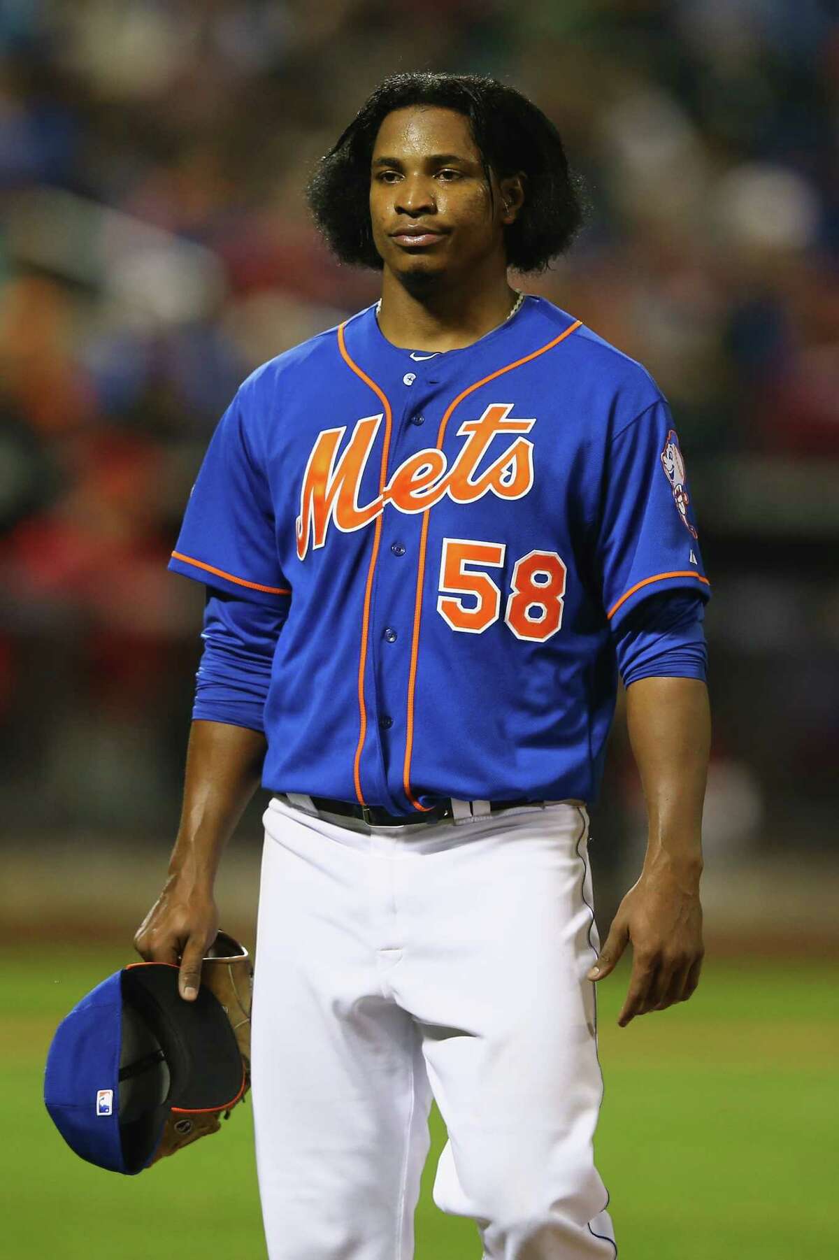 NEW YORK, NY - MAY 09: Jenrry Mejia #58 of the New York Mets leaves the game in the fifth inning against the Philadelphia Phillies during their game on May 9, 2014 at Citi Field in the Flushing neighborhood of the Queens borough of New York City. (Photo by Al Bello/Getty Images) ORG XMIT: 477583015
