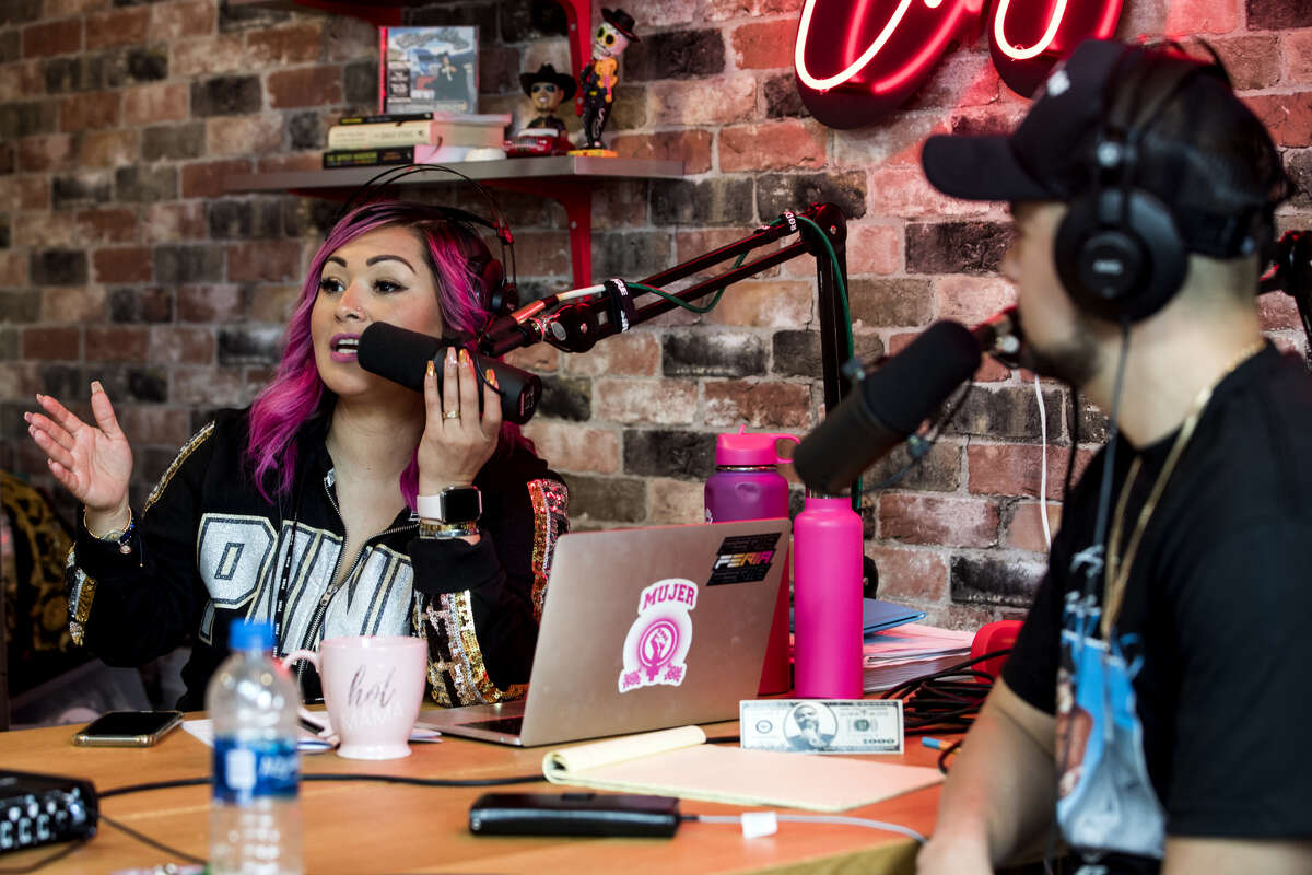 Marisol Herrera, left, and her husband, comedian and rap artist Chingo Bling, record his podcast "What Did He Said?" in his studio on Tuesday, Jan. 22, 2019, in Houston.
