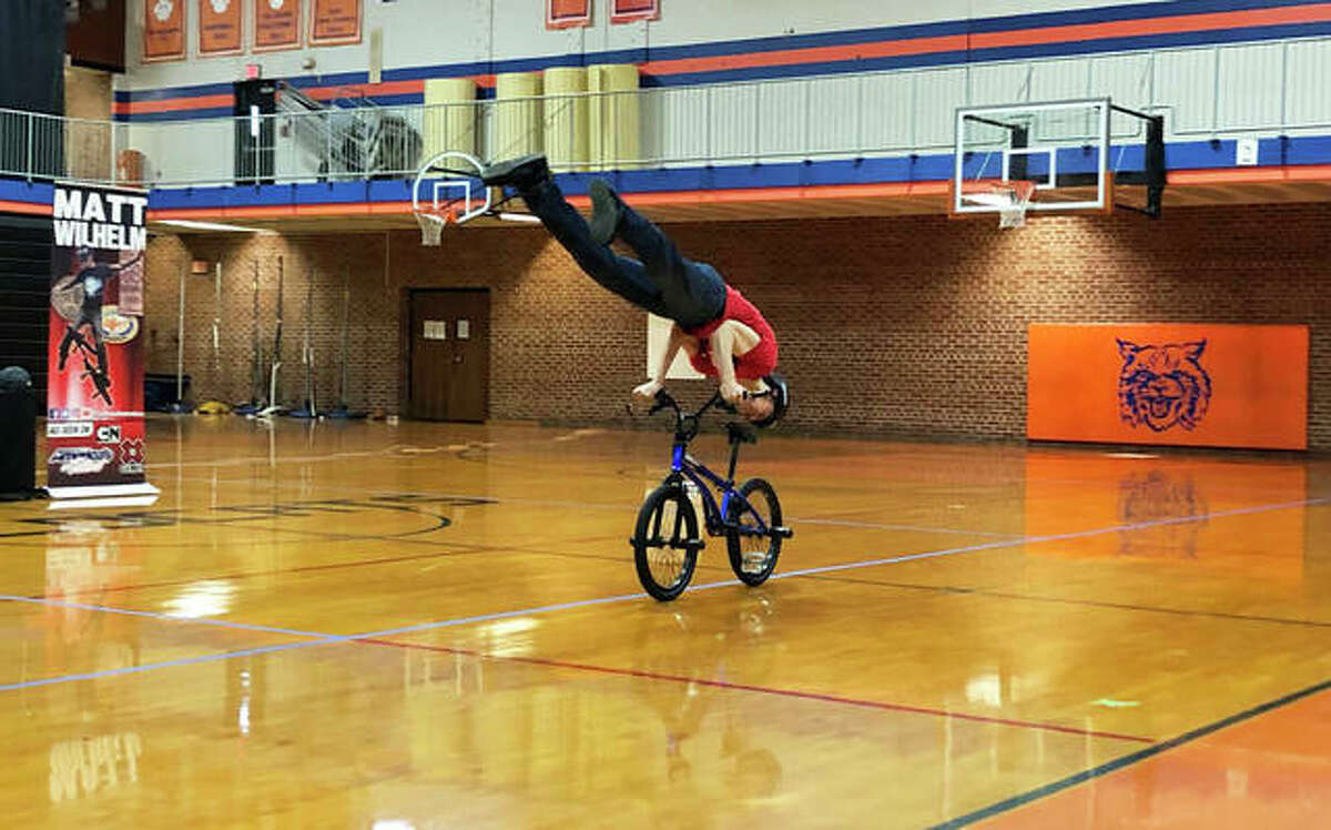 Matt Wilhelm, a three-time X Games medalist, performs tricks for Lincoln Middle School students before speaking to them about his experiences being bullied and how to combat the behavior.