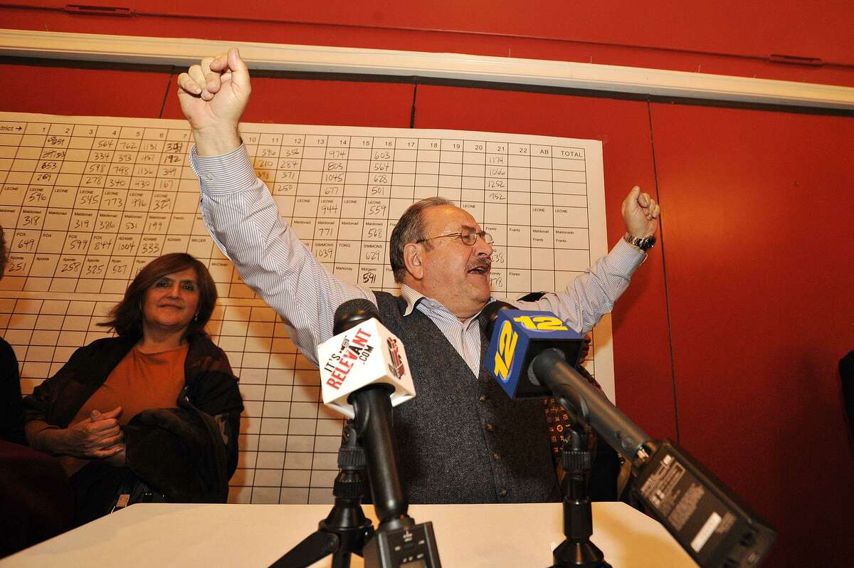 Stamford Democratic Party Chairman John Mallozzi throws his arms in the air while addressing supporters during the Democrat Party election night celebration at Zody's 19th Hole at E. Gaynor Brennan Golf Course in Stamford, Conn., on Nov. 4, 2014.