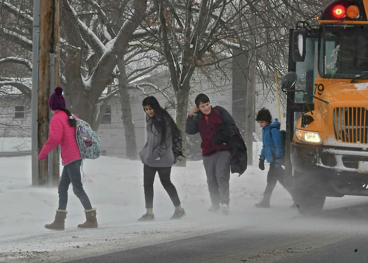 Students are met with high wind gust as they get off a school bus on Balltown Rd. on Wednesday, Jan. 30, 2019 in Niskayuna, N.Y. (Lori Van Buren/Times Union)