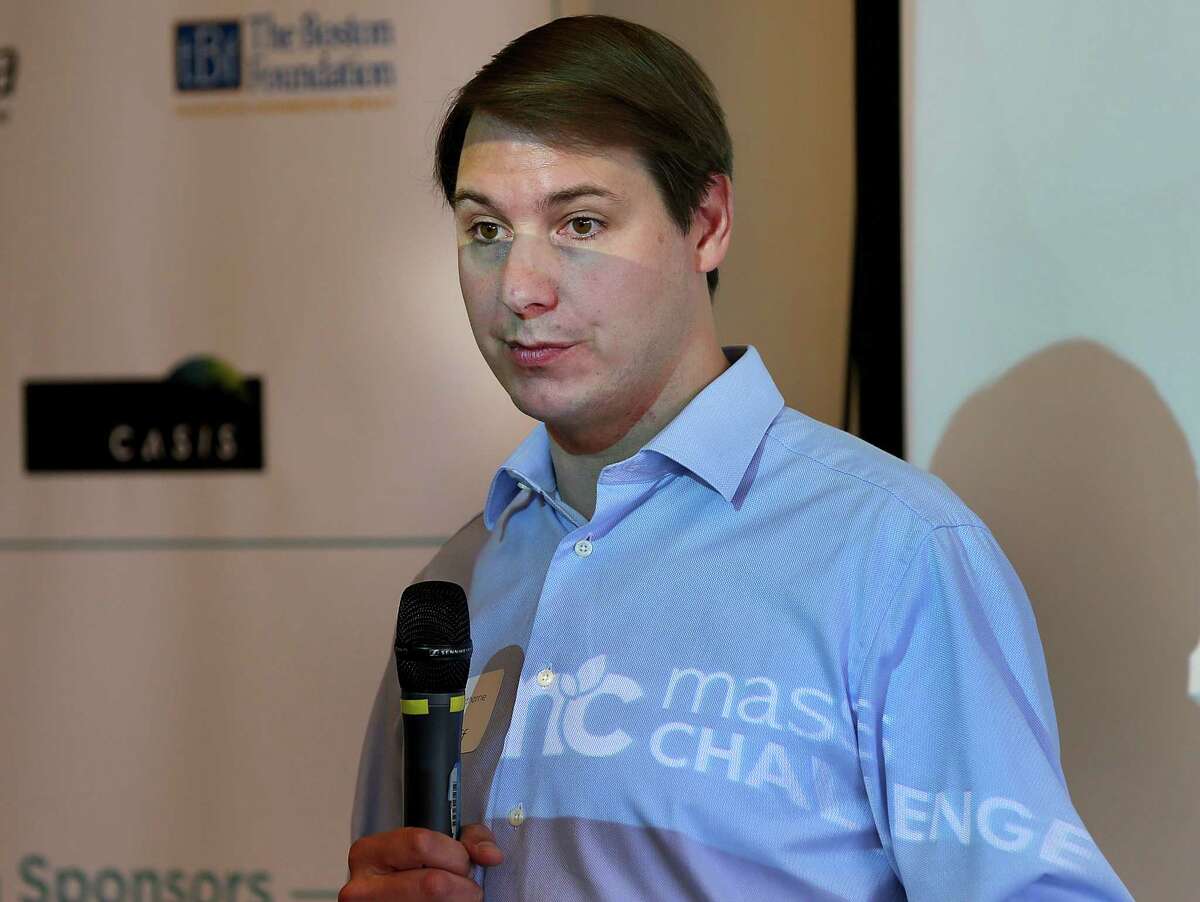 BOSTON, MA - 6/11/2014: Speaking in front of a projector is John Harthorne, CEO & FOUNDER MASSCHALLENGE ....The famed startup contest MassChallenge will open its new offices at Drydock Ave., 6th Floor in South Boston. (David L Ryan/Globe Staff Photo) SECTION: BUSINESS TOPIC 12masschallenge(1)