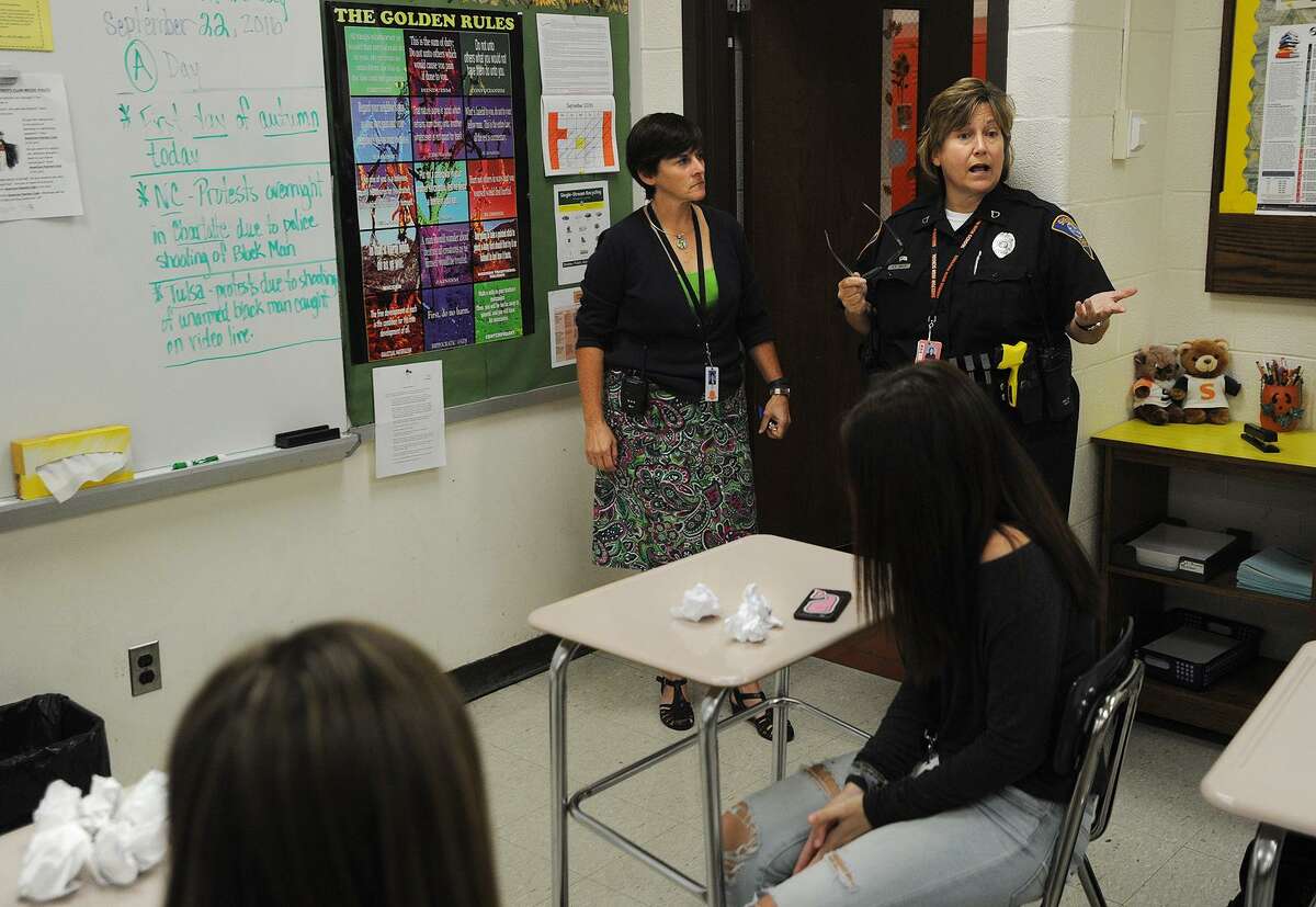 Headmaster Beth Smith, left, and Shelton police Officer Mary Beth White prepares a classroom of students for an ALICE drill at Shelton High School in Shelton, Conn. on Thursday, September 22, 2016. ALICE is an acronym for Alert, Lockdown, Inform, Counter, and Evacuate.