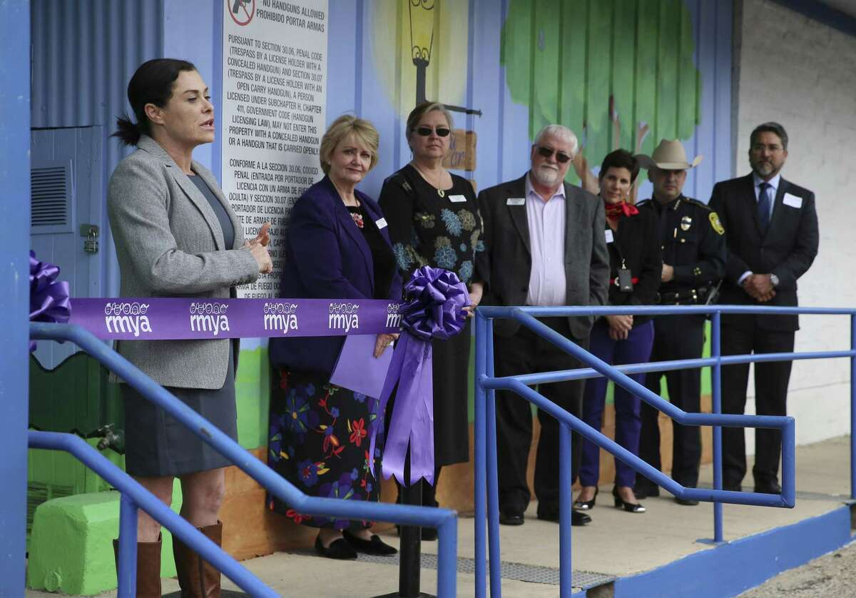 Sex-trafficking survivor Allison Franklin (left) speaks at the ribbon-cutting Jan. 30 for Roy Maas Youth Alternatives’ new emergency shelter for the underage victims of sex-trafficking. La Puerta provides a safe haven for teens who are victims of sex-trafficking and offers services such as counseling and family reunification.
