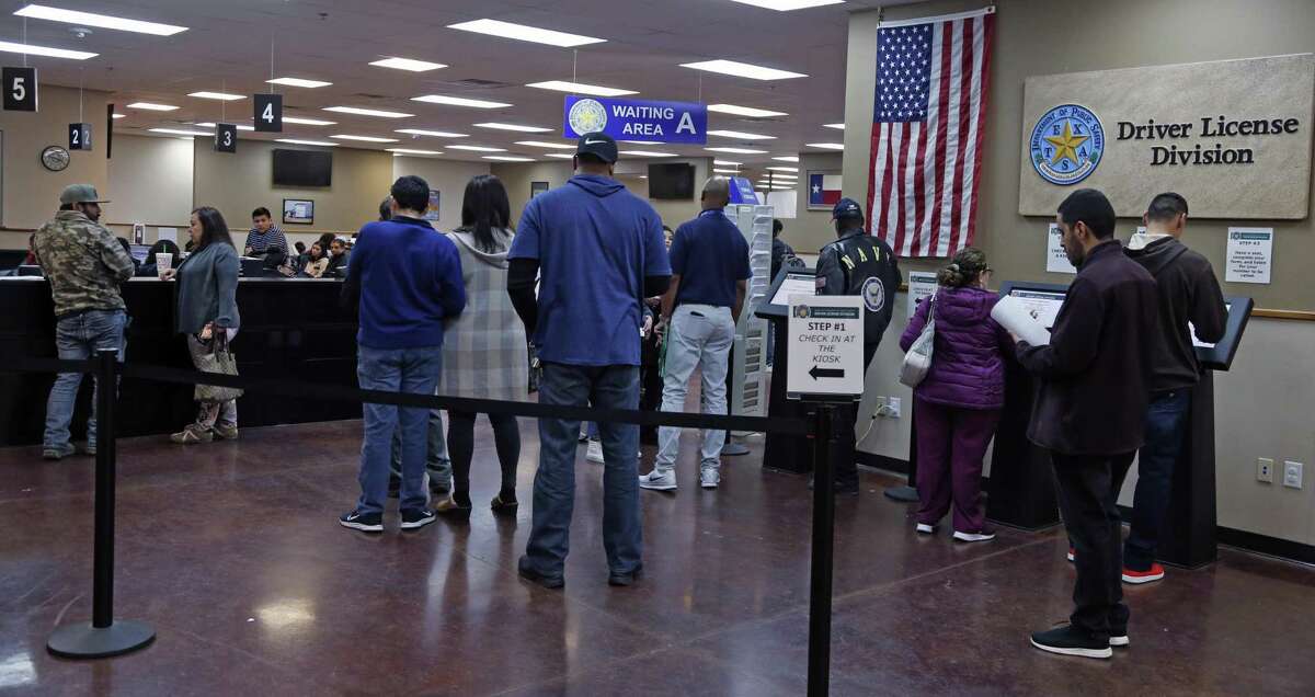 Lines of people wait to get or renew driver licenses at the DPS facility in Leon Valley on Huebner Road on Wednesday.