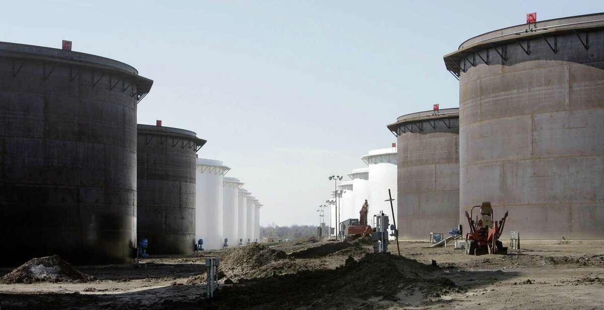 This March 13, 2012 photo shows older and newly constructed 250,000 barrel capacity oil storage tanks at the SemCrude tank farm north of Cushing, Okla. NEXT: See gasoline prices in Texas' biggest cities.