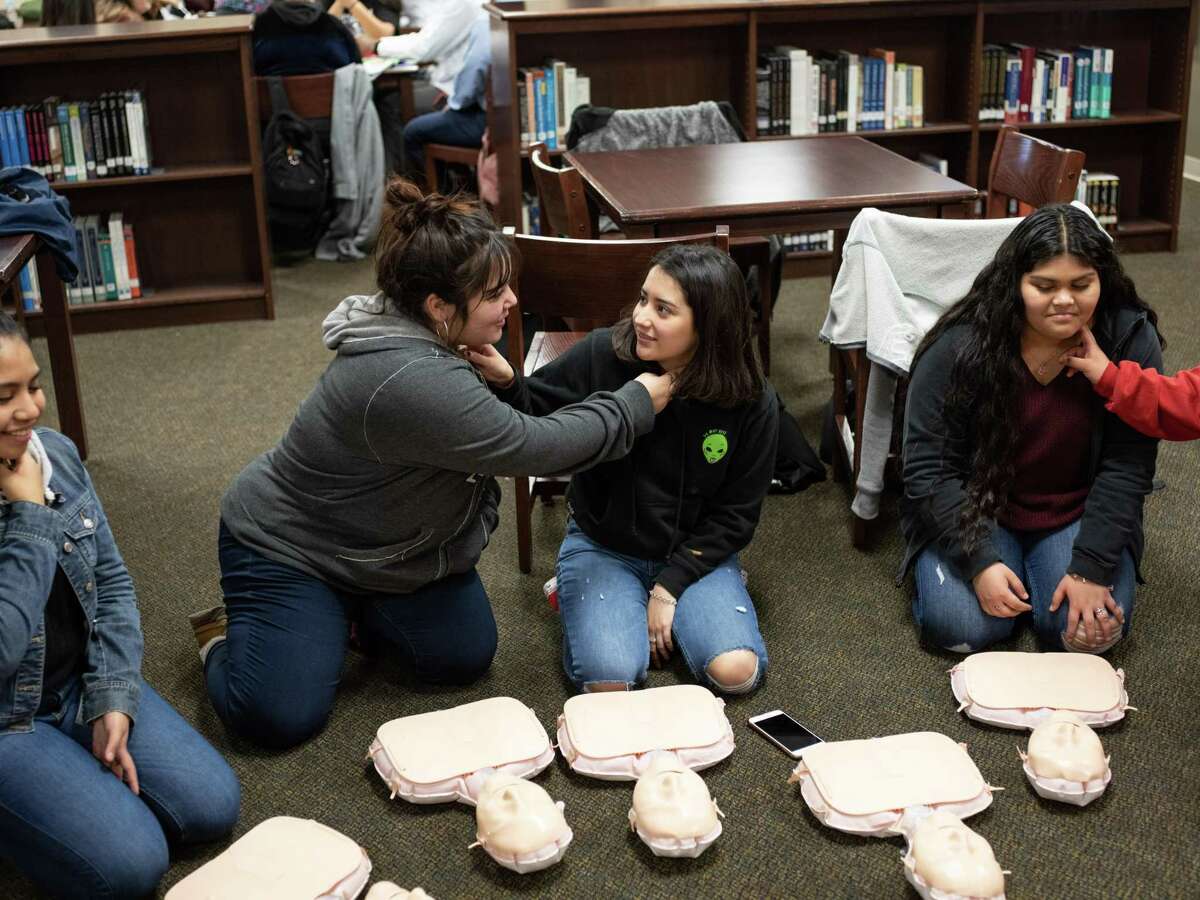From left, Southside High School students, Paula Castro, Genevieve Ibarra, Sierra Carranza, and Emily Zermeno check each others’ pulses during a medical training day put on by students from UIW's School of Osteopathic Medicine at Southside High School on Wednesday, January 30, 2019. Medical students from UIW led workshops for Southside High School students on topics including CPR, surgery and mental health as part of their “Mini D.O. Day.” Sneha Aidasani, a second year medical student at UIW who helped to design the program, says that although the students may face barriers in terms of finances and transportation, it's important that they see what opportunities are open to them. “I think that’s literally the avenue we’re trying to take by coming here to SISD and helping students to speak about their barriers. To use those barriers not as an obstacle but as an empowerment tool. At the end of the day they are kids, so I think it is important to support and nurture all their goals, whatever they may be,” Aidasani said. The program hopes to become an annual event.