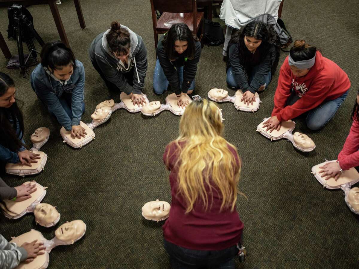 Southside High School students learn the basics of CPR during a medical training day put on by students from UIW's School of Osteopathic Medicine at Southside High School on Wednesday, January 30, 2019. Medical students from UIW led workshops for Southside High School students on topics including CPR, surgery and mental health as part of their “Mini D.O. Day.” Sneha Aidasani, a second year medical student at UIW who helped to design the program, says that although the students may face barriers in terms of finances and transportation, it's important that they see what opportunities are open to them. “I think that’s literally the avenue we’re trying to take by coming here to SISD and helping students to speak about their barriers. To use those barriers not as an obstacle but as an empowerment tool. At the end of the day they are kids, so I think it is important to support and nurture all their goals, whatever they may be,” Aidasani said. The program hopes to become an annual event.