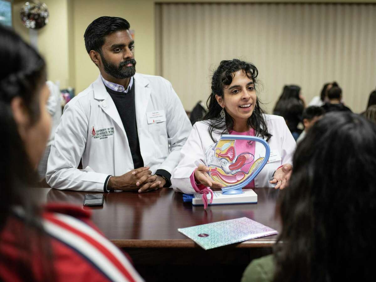 UIW's School of Osteopathic Medicine students Sanu John, left, and Nadia Nayar, right, teach Southside High School students about women's reproductive health during a medical training day put on by the UIW students last year. The medical school has received a two-year state grant to bolster its residency programs in specialties that face physician shortages in Texas.