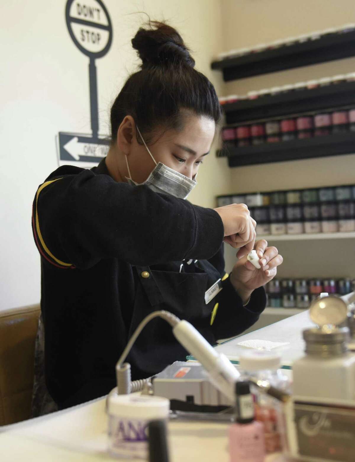Employees work at a nail salon in Stamford, Conn. Wednesday, Jan. 16, 2019. Since 2015, the Department of Labor has issued 91 stop work orders to Connecticut nail salons for labor law violations, including to salons in Greenwich, Stamford, Milford, New Haven, Darien, Westport, Southport.