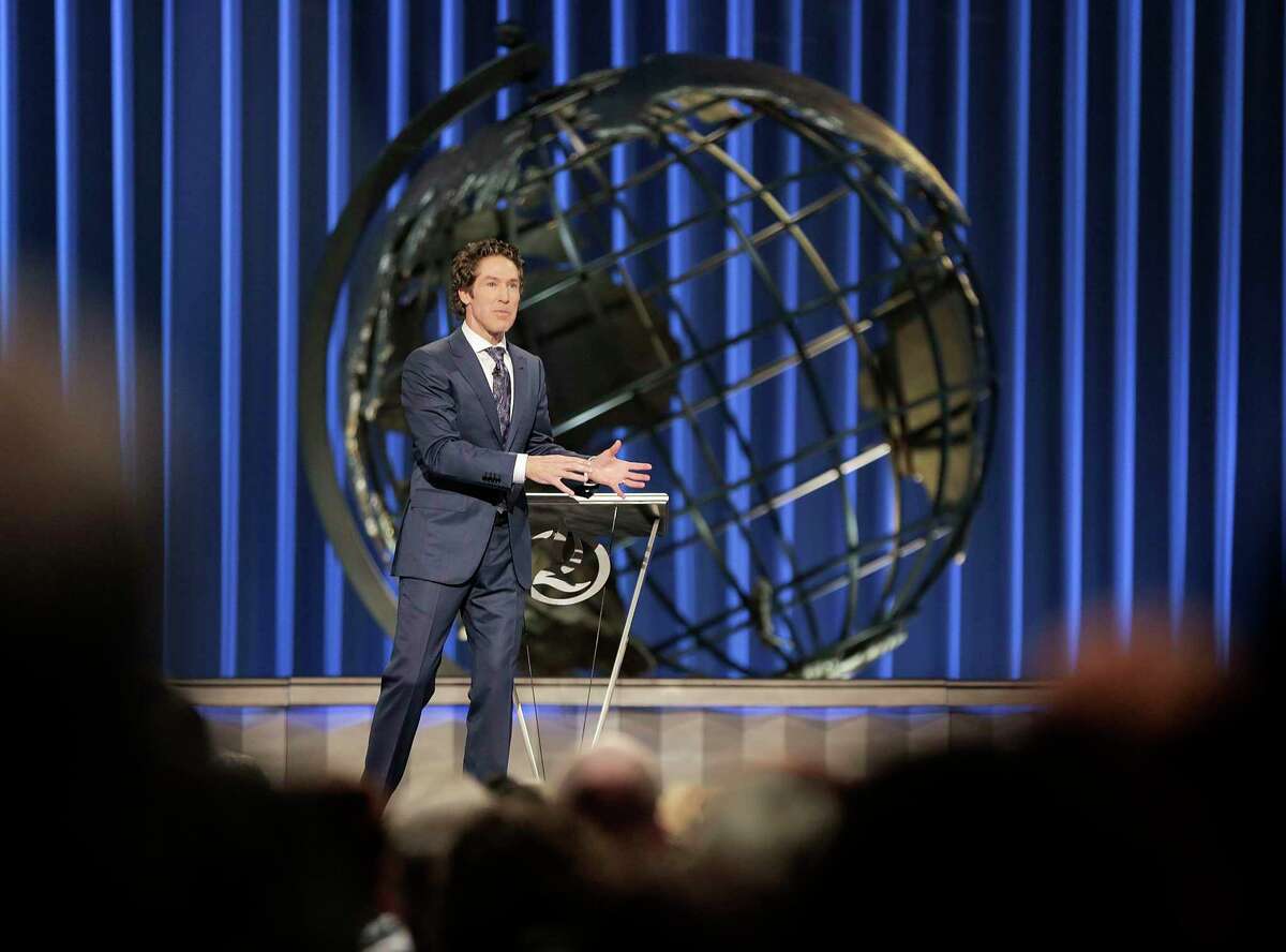 In this file photo, Lakewood Church Pastor Joel Osteen delivers a sermon at the Houston mega church on Sunday, April 22, 2018.