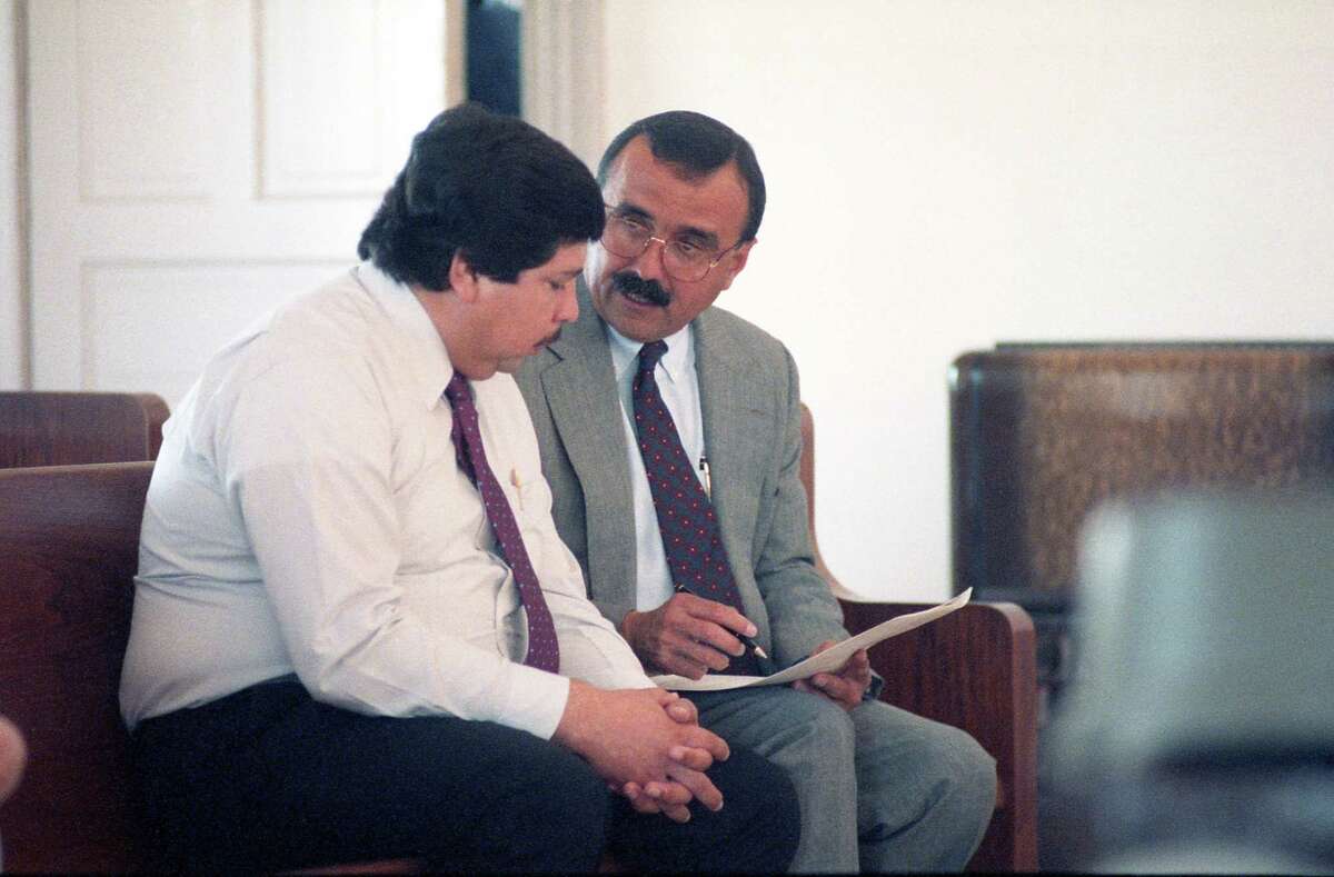 Former Catholic priest Fernando Noe Guzman speaks with his attorney, Candelario Elizondo, in 1992 at the Grimes County courthouse in Anderson, north of Houston.  Guzman was accused of molesting a 14-year-old girl at her grandfather’s home. The allegations against him surfaced after a church secretary in Galena Park file a multimillion-dollar lawsuit accusing him of forcing her into a sexual relationship. The lawsuit was dismissed, but Guzman was charged with sexual assault in Grimes County. He pleaded guilty, was granted shock probation and served 90 days in jail. Guzman, who died in 2006, was removed from the ministry in 1987.