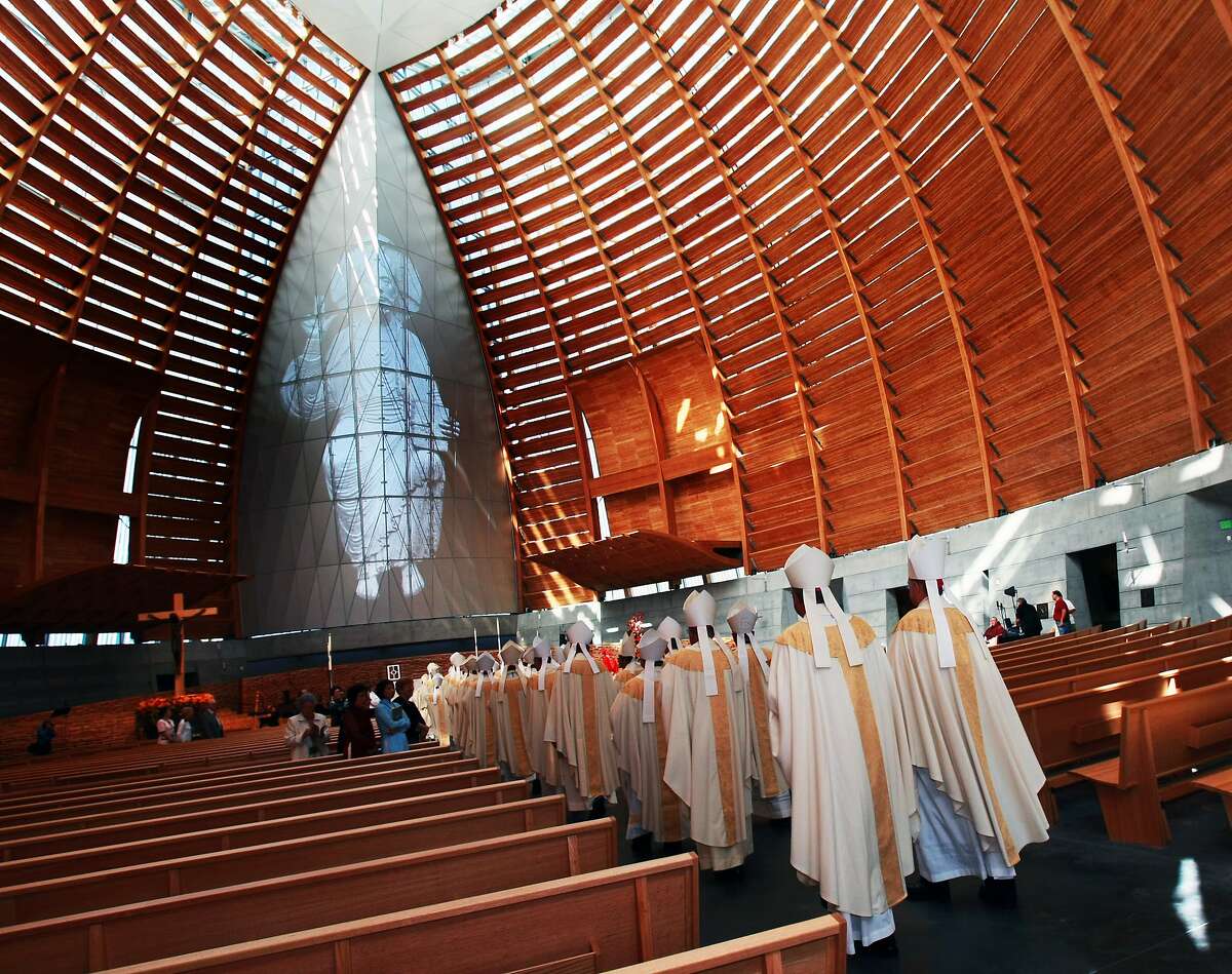 FILE -- Visiting Bishops walk down the center aisle during the dedication ceremony of The Cathedral of Christ the Light Thursday in Oakland, Calif. An Oakland priest has apparently fled the country after being placed on leave and accused of sexual misconduct with a minor.
