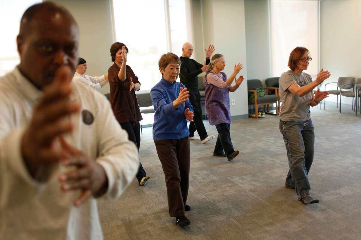 Tai Chi Chuan instructor Joseph Acquah, left, teaches Tai Chi Chuan at the Osher Center for Integrative Medicine to a group of students including Kat Peirce( fifth from right to right), Grace Dote, Leon Lord, Susan Green and Alex Schott on Wednesday, February 9, 2011 in San Francisco, Calif.