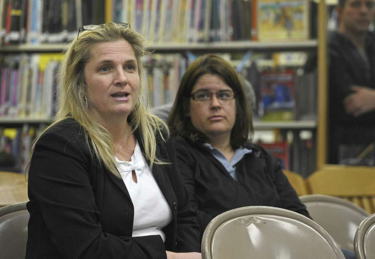 Susan Schullery, a parent from Kent, asks question about the town selectmen voting to recommend that the Board of Education consider adopting a school safety program that includes arming teachers and other school staffers with guns, during the Board of Education meeting on Thursday night, February 4, 2016, in Kent, Conn.