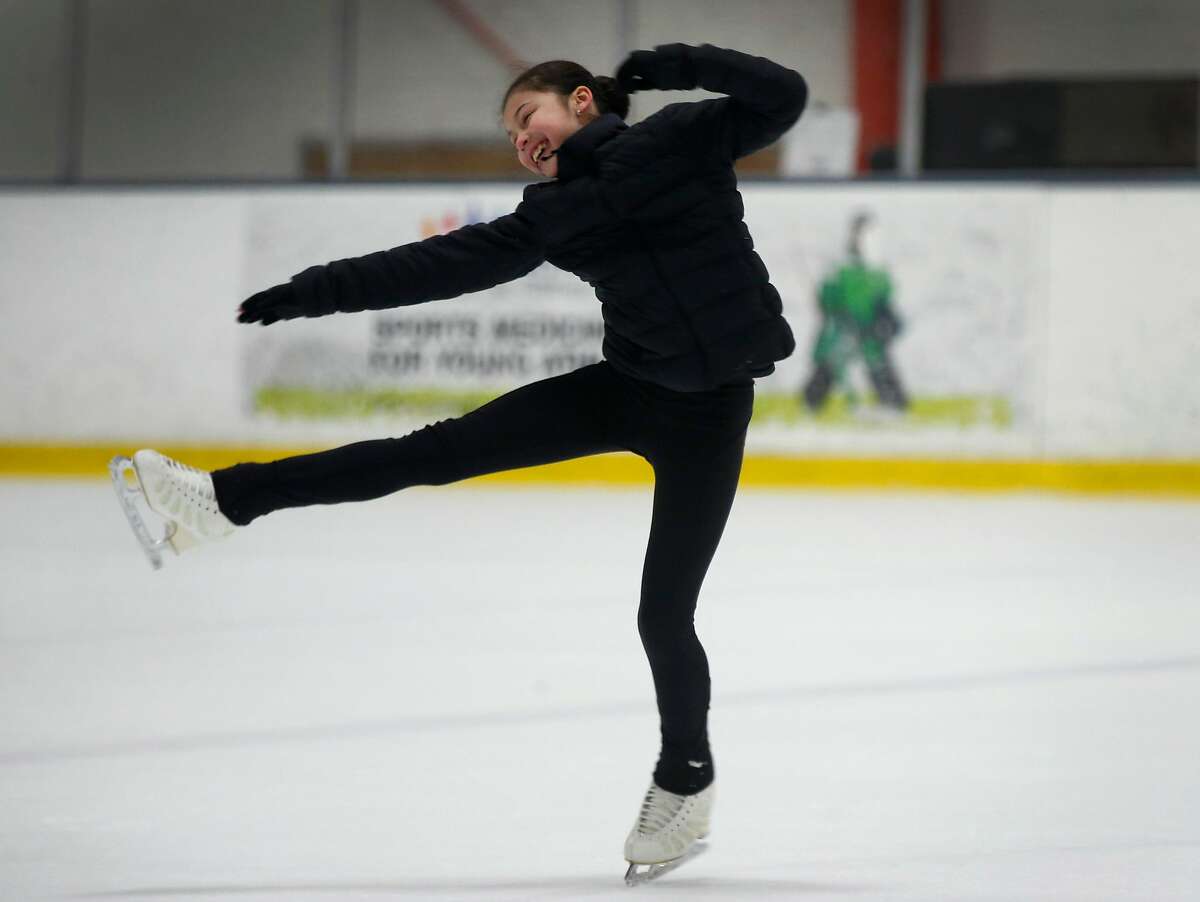 Figure skater Alysa Liu returns home a champion, yet still a kid