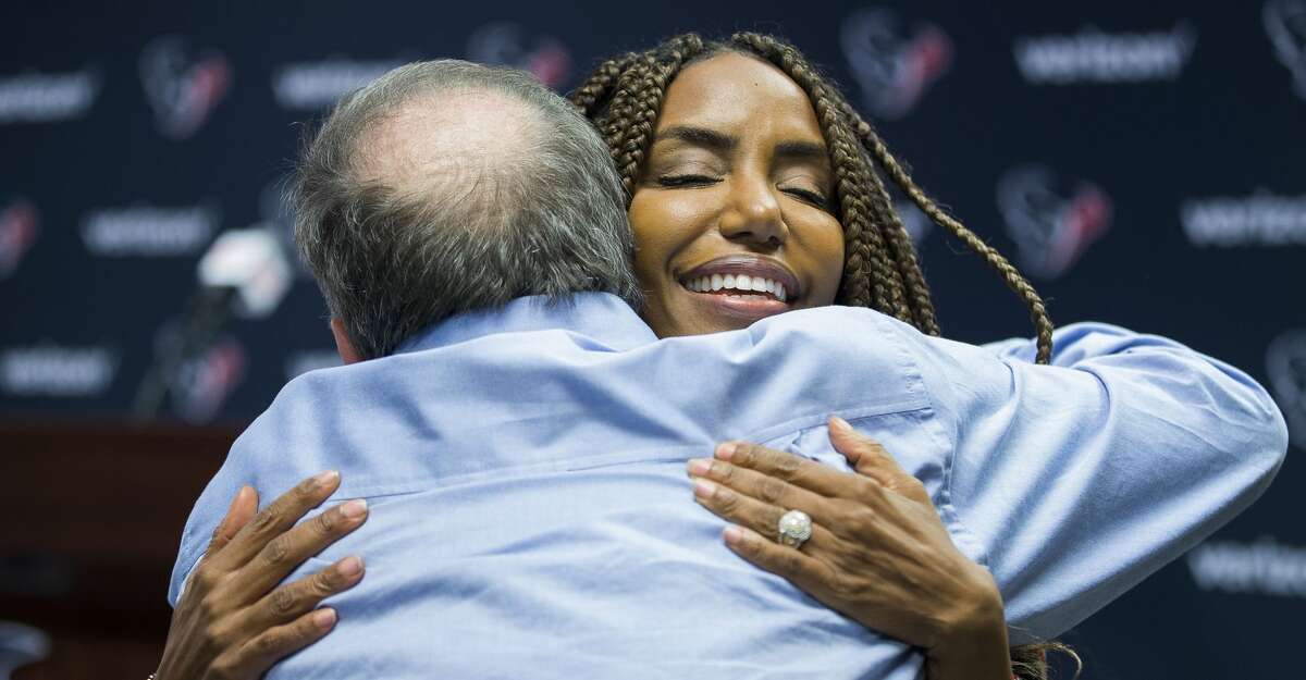 Tiffany Smith hugs a reporter after a press conference in the media workroom at NRG Stadium, Monday, Jan. 1, 2018, in Houston. Tiffany's husband, Texans general manager Rick Smith, announced that he will be taking an extended leave of absence to help care for his wife, Tiffany, who was diagnosed with breast cancer in 2017, Smith said. ( Mark Mulligan / Houston Chronicle )