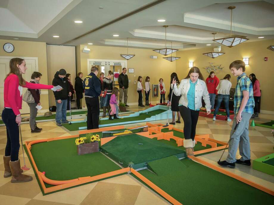 The 10th Annual “Live, Laugh then Putt” Indoor Mini Golf fundraiser will be held at the Woodbury Senior Community Center, Feb. 15-18. A 9-hole course offers challenges players of all ages in teams of four people. Cost is $2 for age 10 and under with an adult; $3 for adults including seniors, and $4 for teens. Net proceeds from the event will support the Woodbury Community Services’ Food Bank, Fuel and Crisis Assistance Programs. Volunteers and donations are also needed. For information, call Charles Bartlett at 203-572-2724 or Sharon Sherman at 203-695-5410. Photo: Contributed Photo / ©2016 David Peter Arnold