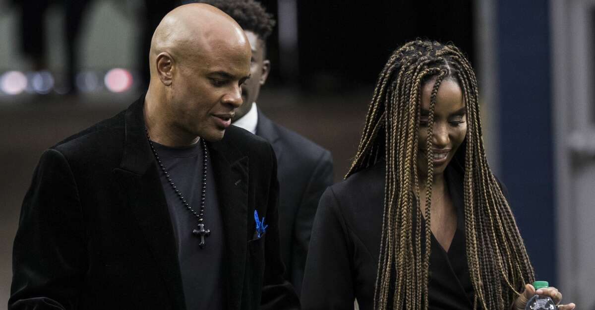 Former Houston Texans general manager Rick Smith and his wife Tiffany arrive to a public celebration of life for Houston Texans owner Robert C. McNair at NRG Stadium, Friday, Dec. 7, 2018, in Houston. McNair, who brought the NFL back to Houston after the Oilers left for Tennessee, died on Nov. 23 at the age of 81.