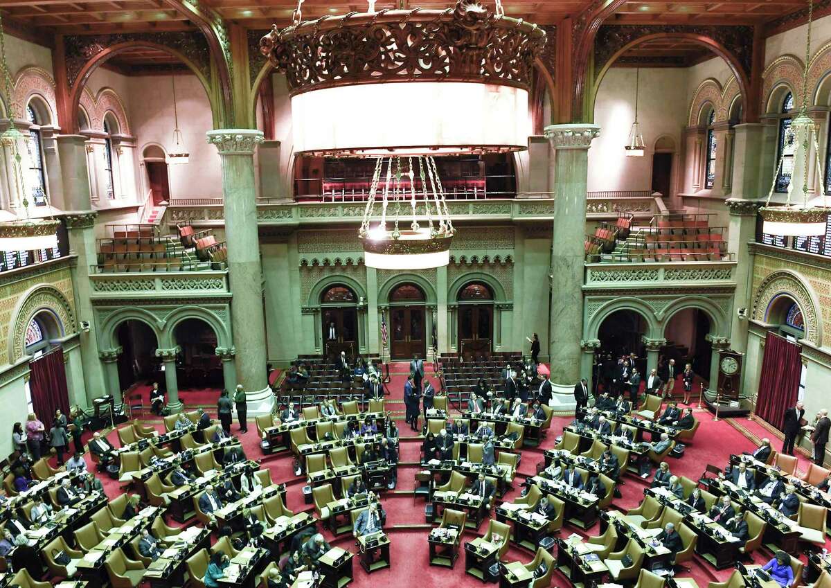 New York state Assembly members debate new legislation in the Assembly Chamber at the state Capitol on Tuesday, Jan. 29, 2019, in Albany, N.Y. (AP Photo/Hans Pennink)