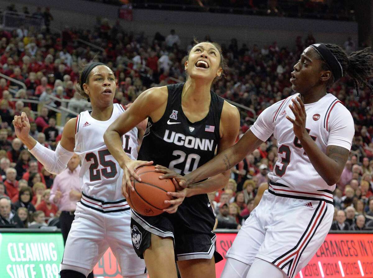 Connecticut forward Olivia Nelson-Ododa (20) looks to shoot as Louisville guards Jazmine Jones (23) and Asia Durr (25) defend during the first half of an NCAA college basketball game in Louisville, Ky., Thursday, Jan. 31, 2019. (AP Photo/Timothy D. Easley)