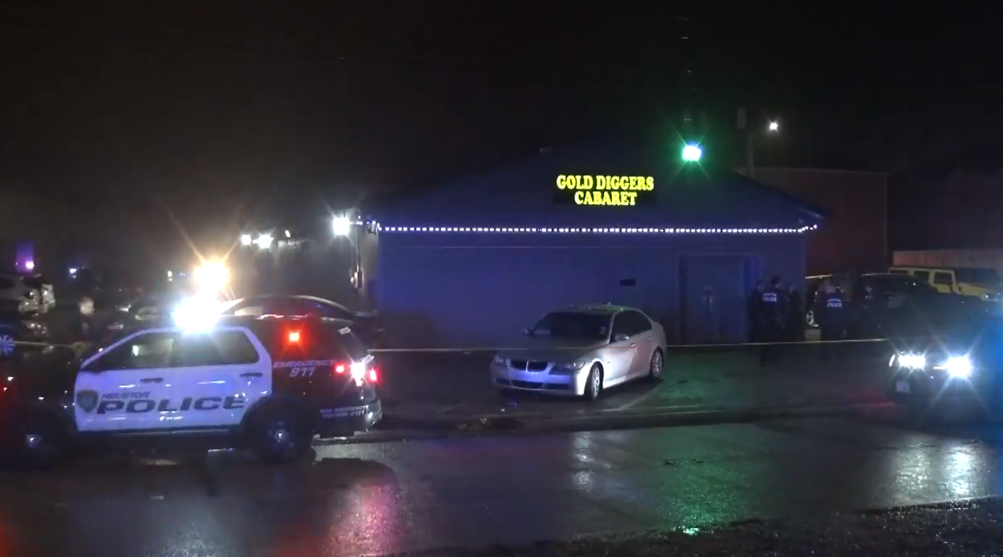 Two security guards hurt after man opens fire with a rifle outside strip  club