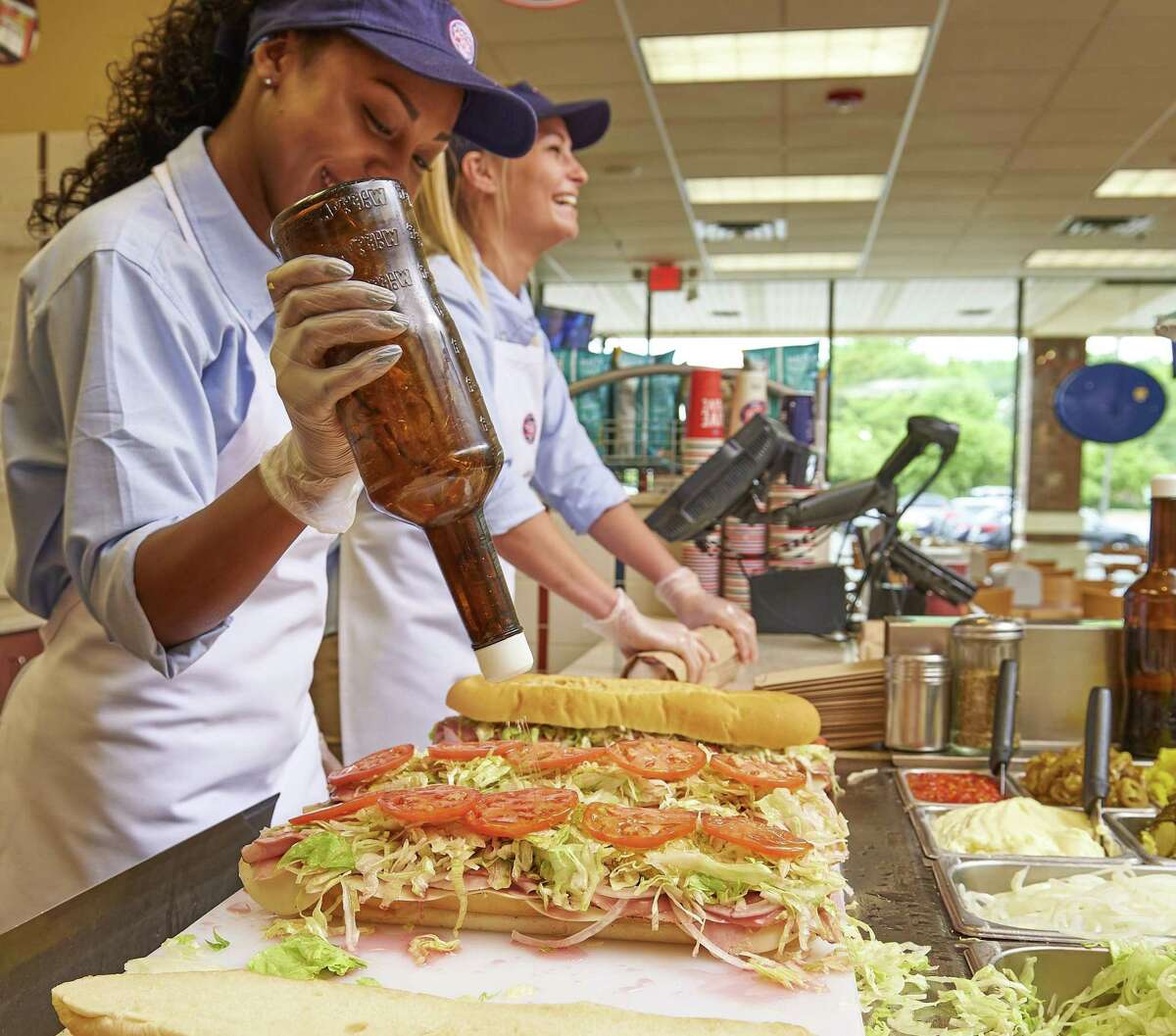 Workers make subs at a Jersey Mike’s shop in Holmdel, N.J. A Jersey Mike’s shop is scheduled to open in the summer of 2019 at 1259 E. Putnam Ave., in Greenwich, Conn.