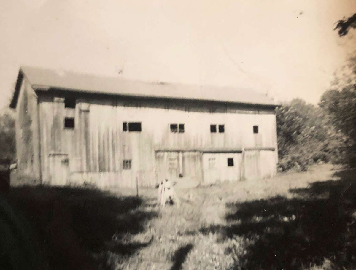 Spectrum/The landscape of Route 202 has evolved over the years. This is the DuPort Barn that once stood on the property that more recently housed the now-vacant CL&P building on Route 202, across from Sunoco. Joseph DuPort bought the house nearby in the 1930s and kept the apple business going. The barn is a Bostwick barn. If you have a 