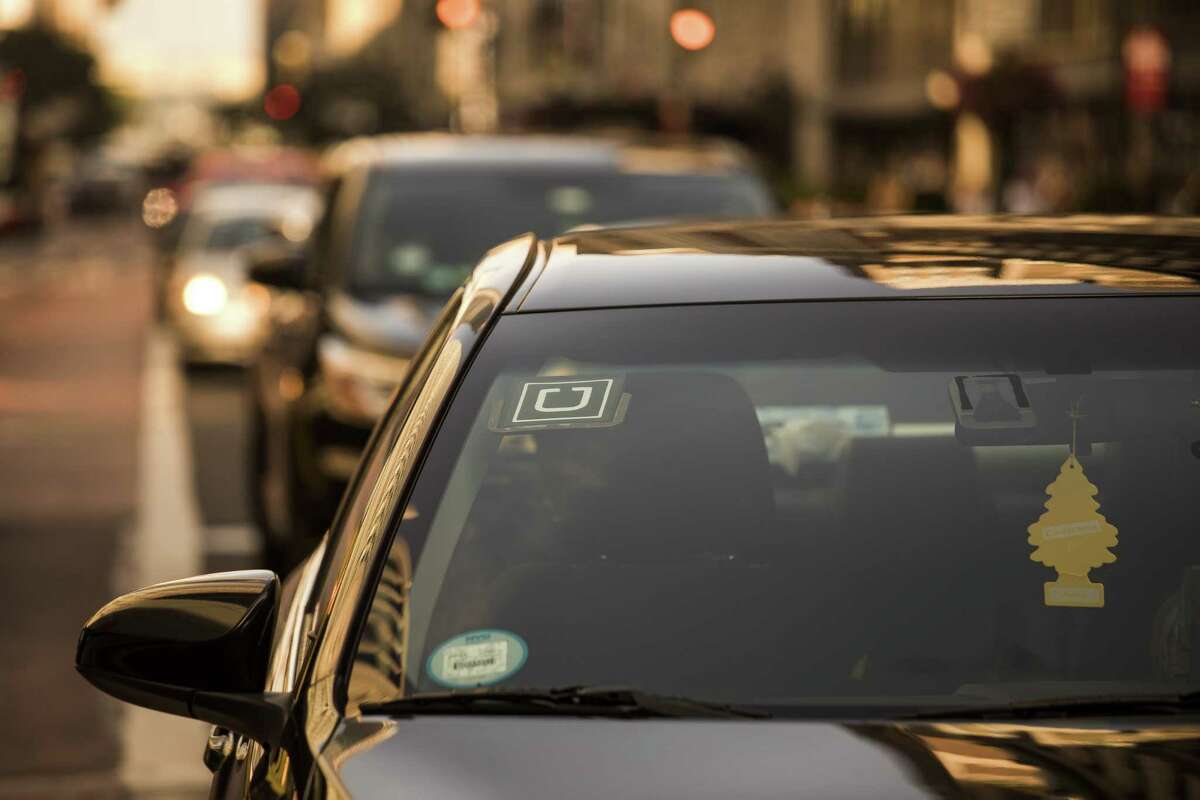 The Uber Technologies logo is seen on the windshield of a vehicle in New York on Aug. 9, 2018.