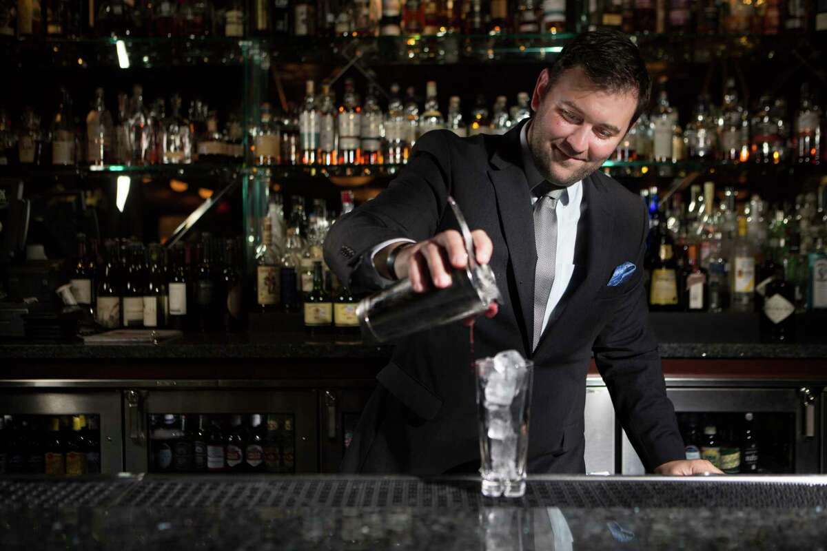 Matt Tanner, Concept Beverage Manager at Pappas Bros. Steakhouse, prepares a drink at the bar, Tuesday, March 15, 2016, in Houston.