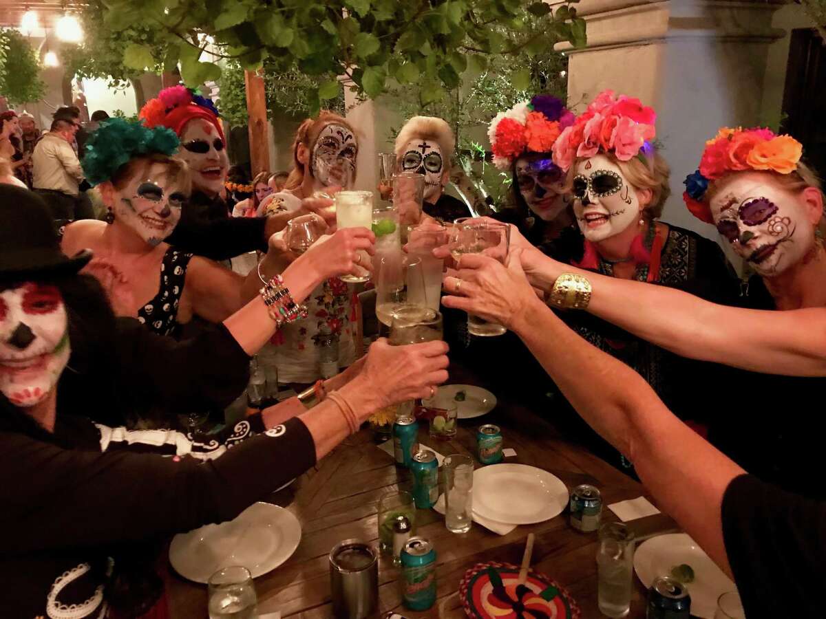 A group of Austin Next Tribers raise a toast during a trip to San Miguel de Allende, Mexico, for Day of the Dead.