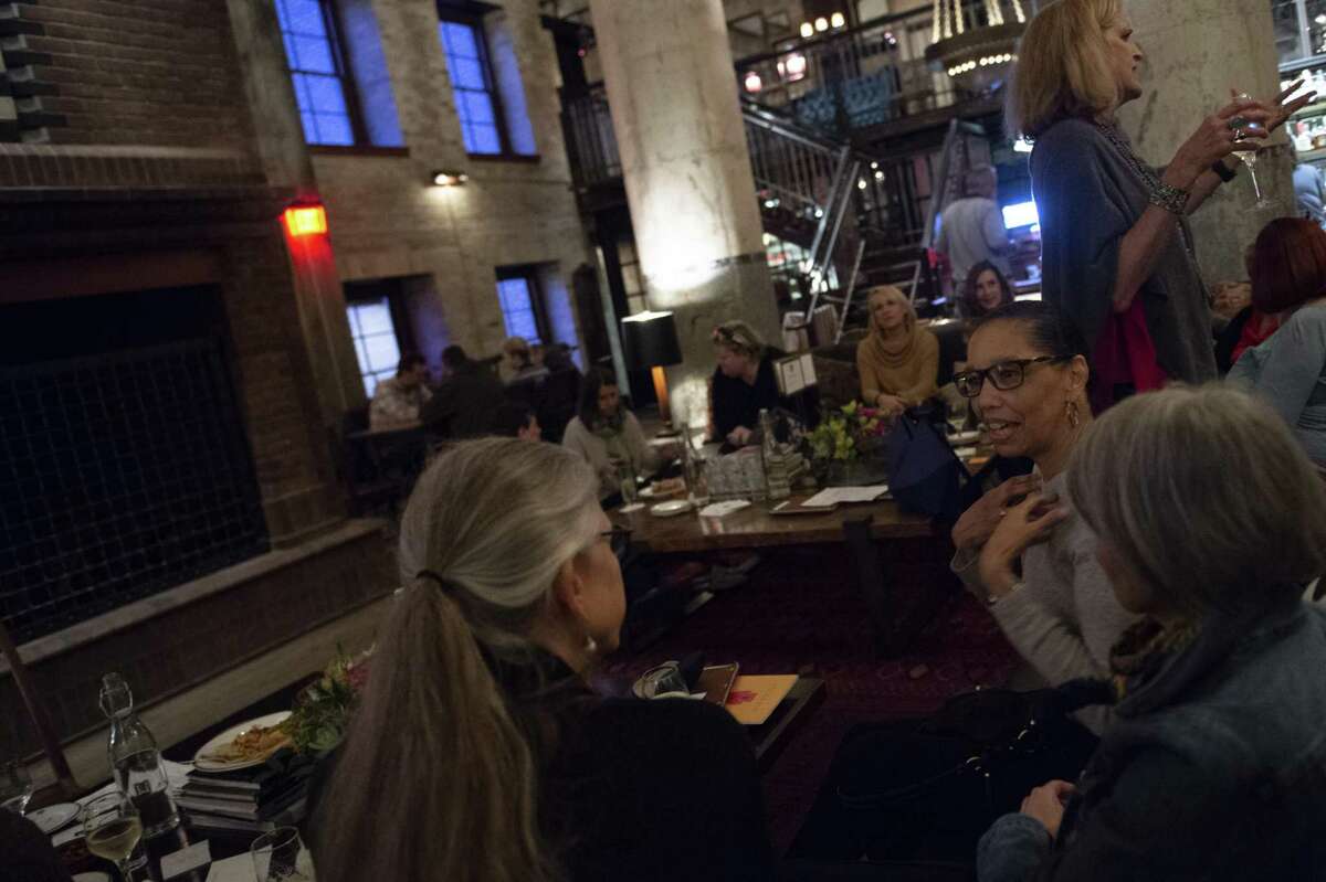 Alyssa Downey, right, speaks with Susan Clements Negley, as Jeannie Ralston looks on. The Austin chapter of the group has traveled to San Miguel de Allende and to a yoga, writing and photography retreat in Troncones, Mexico.