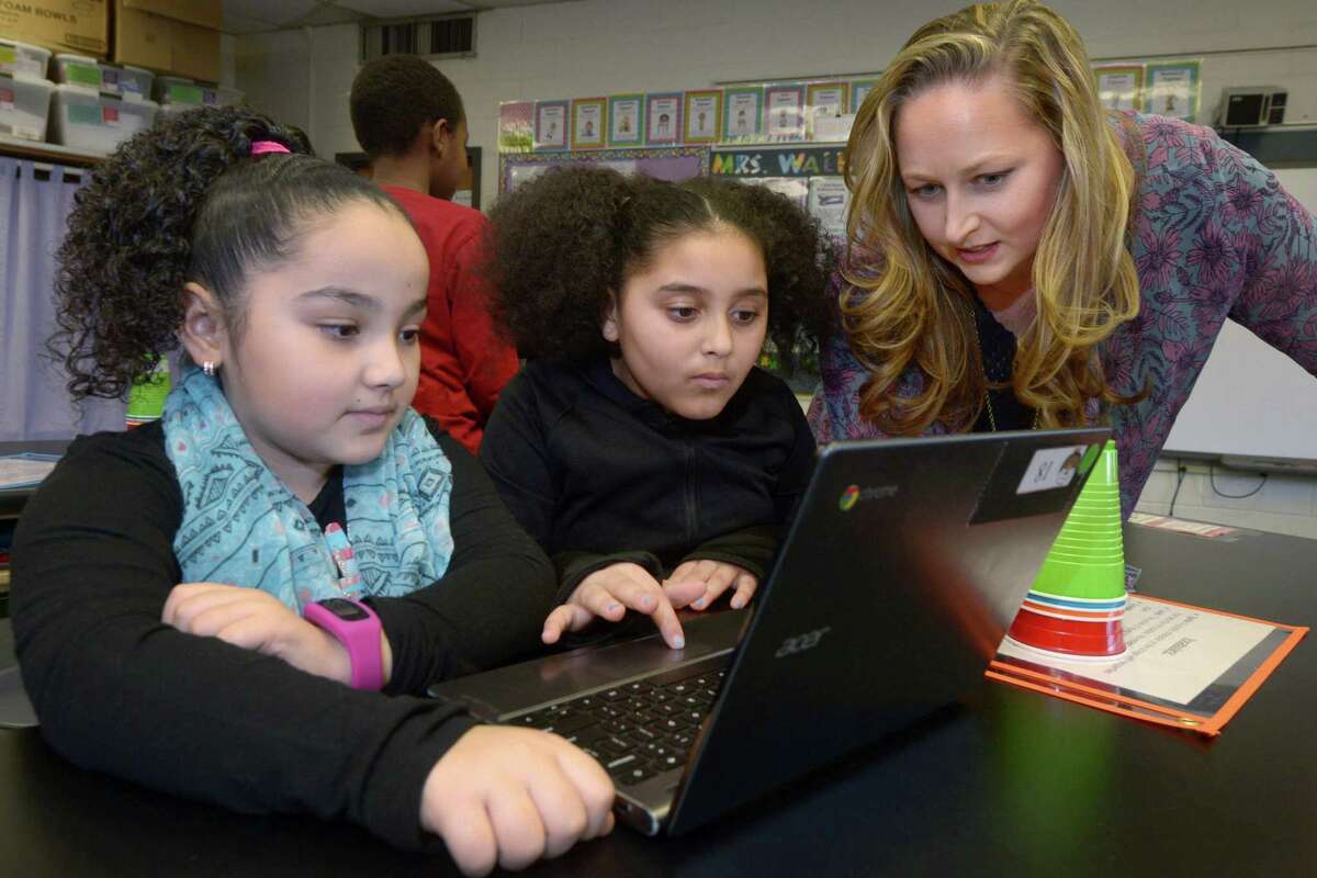 Jefferson Science Magnet School teacher Diana Walker teaches coding to her 4th grade class including Mariella Osuba and Sophia Freeman Tuesday, January 15, 2019, at the school in Norwalk, Conn.