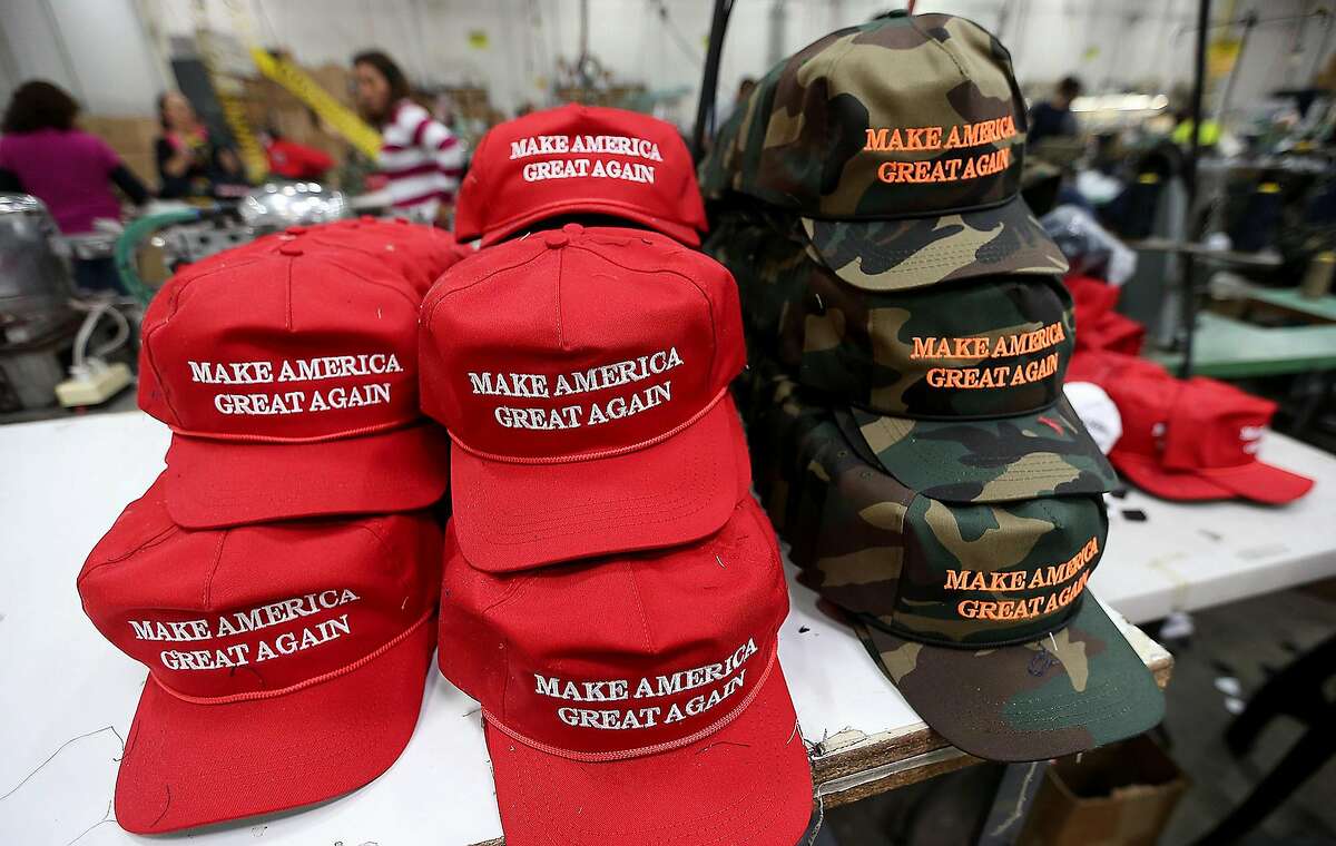 FILE PHOTO: Workers stitch together hats on the factory floor of Cali Fame and Cali Headwear in Carson, Calif. The hat and apparel maker is best known for producing Donald Trump's "Make America Great Again" baseball caps. 